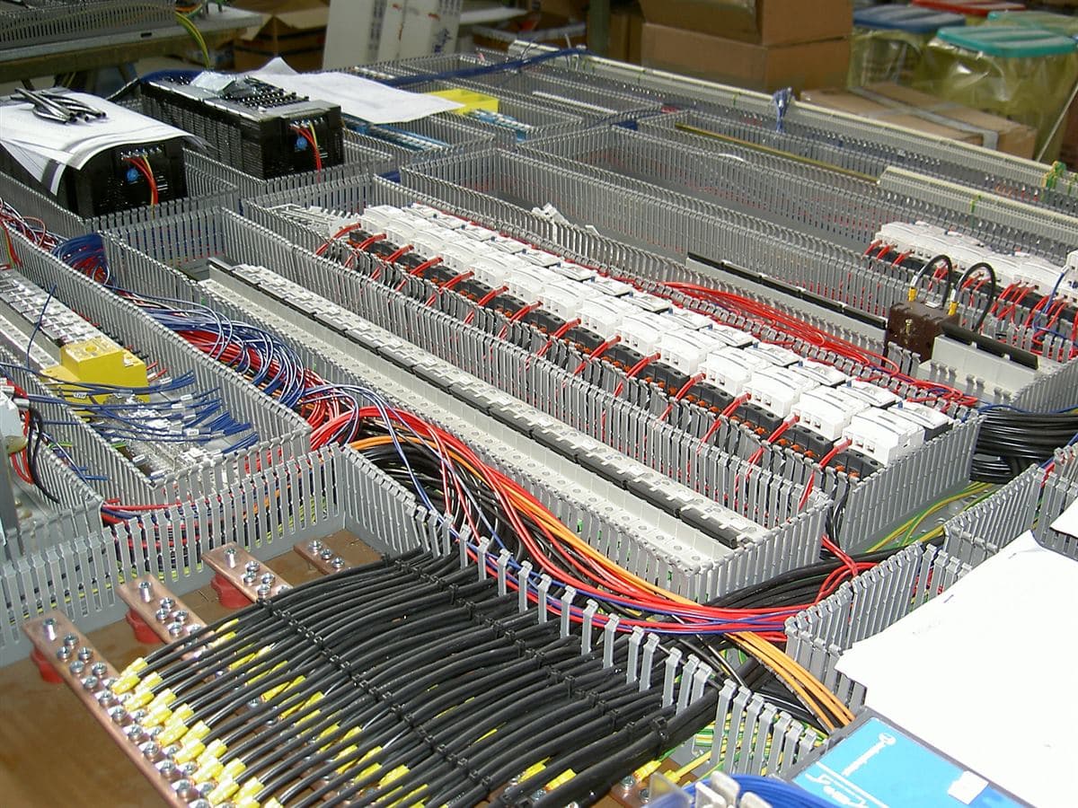Control panel wiring with labelled terminals and cable ducting